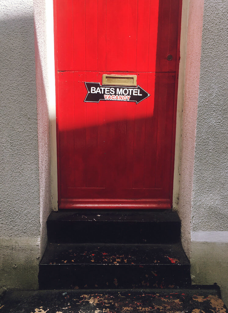 Bates Motel sign on the red door of 20th Century Flicks on Christmas Steps, Bristol