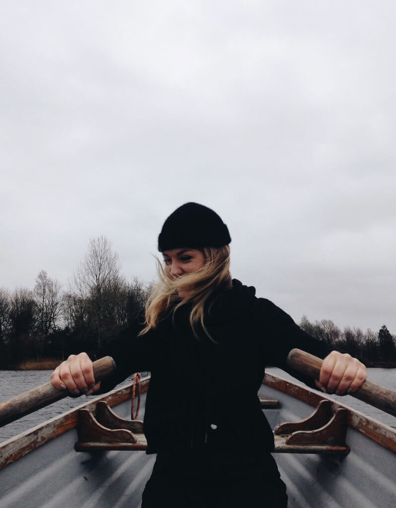 Rowing on the lake at Log House Holidays lakeside cabin retreat in the Cotswolds