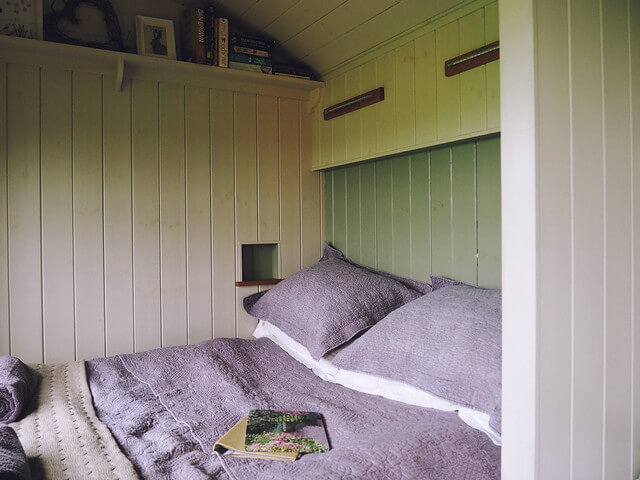 inside a shepherds hut in Dorset, a Plankbridge shepherds hut at colber farm