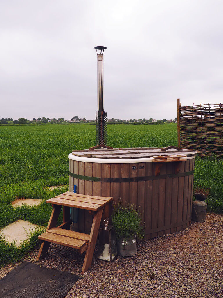 Stay in a shepherds hut in Dorset, a Plankbridge shepherds hut with hot tub at colber farm