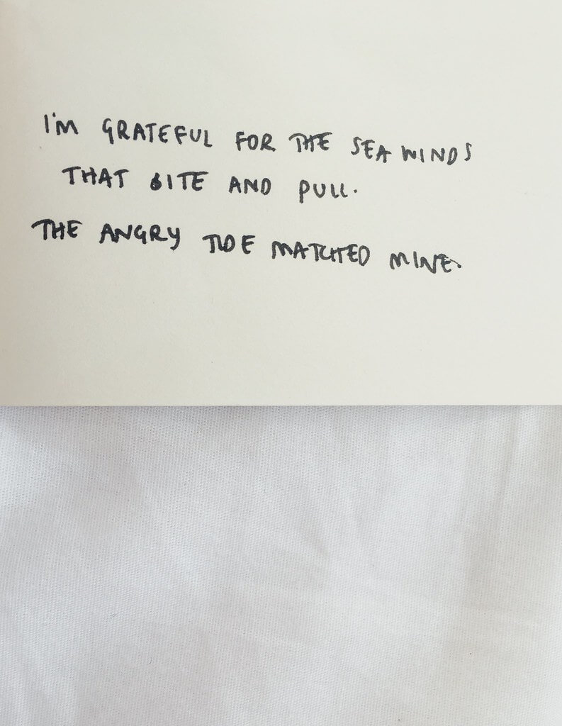 Hand written note reads, "I'm grateful for the sea winds that bite and pull. The angry tide matched mine."