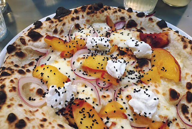 Bertha's pizza with peach and goats curd