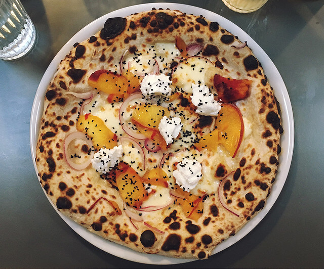 Bertha's pizza with peach and goats curd