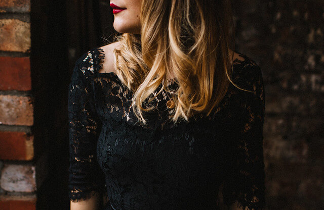 Lyzi Unwin wears vintage style black lace Joanie dress at a Christmas party at The Forge, Bristol