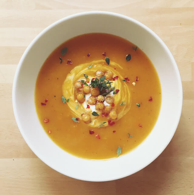 A bowl of butternut squash soup with crispy chickpeas