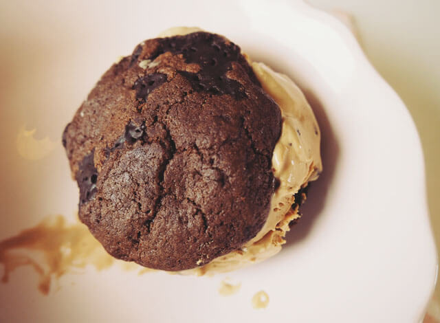 Chocolate chip cookie & coffee ice cream sandwich in a pale pink bowl