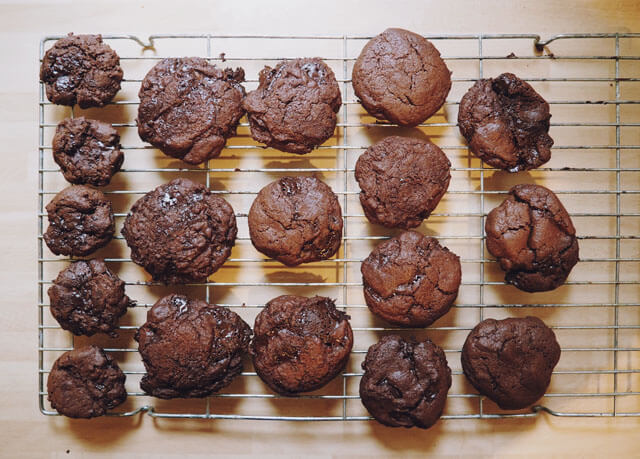 Double chocolate chip cookies cooling on a wire rack