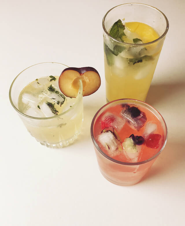 3 glasses of colourful fruity cocktails