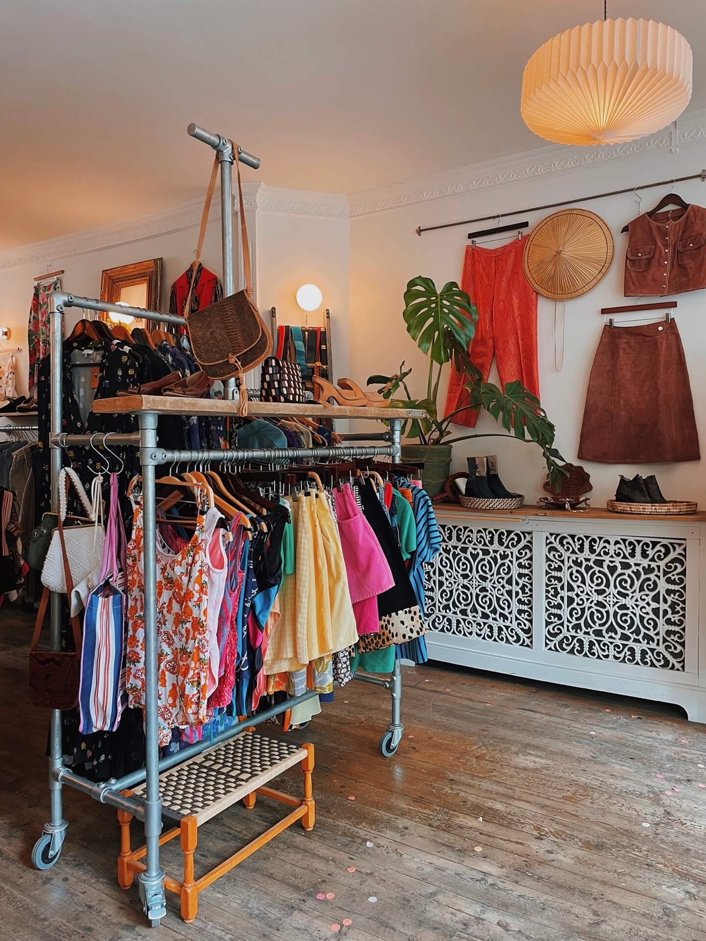 Clothing rails and display inside Three of Cups Vintage shop in Penryn
