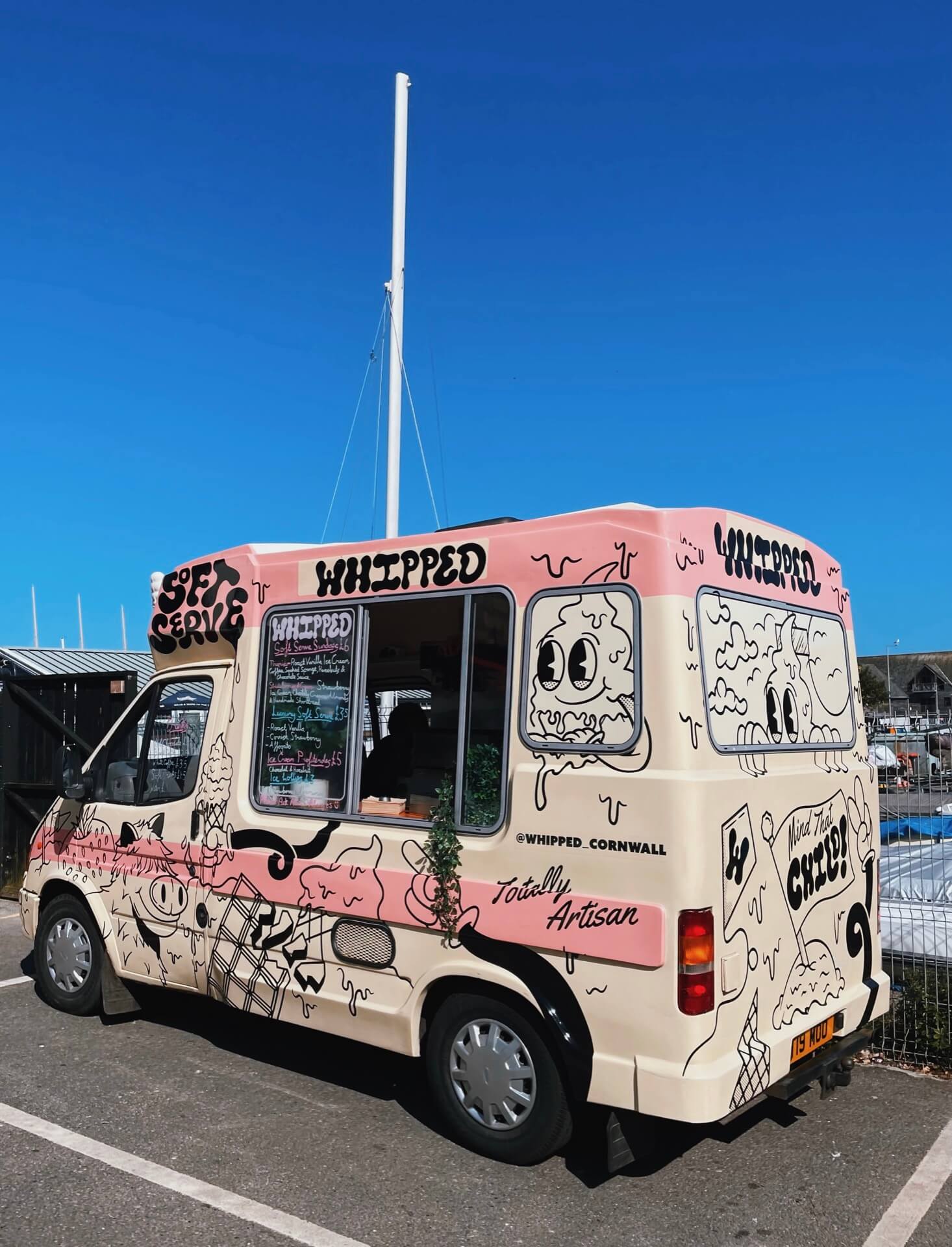 "Whipped" pink and cream icecream van and blue sky