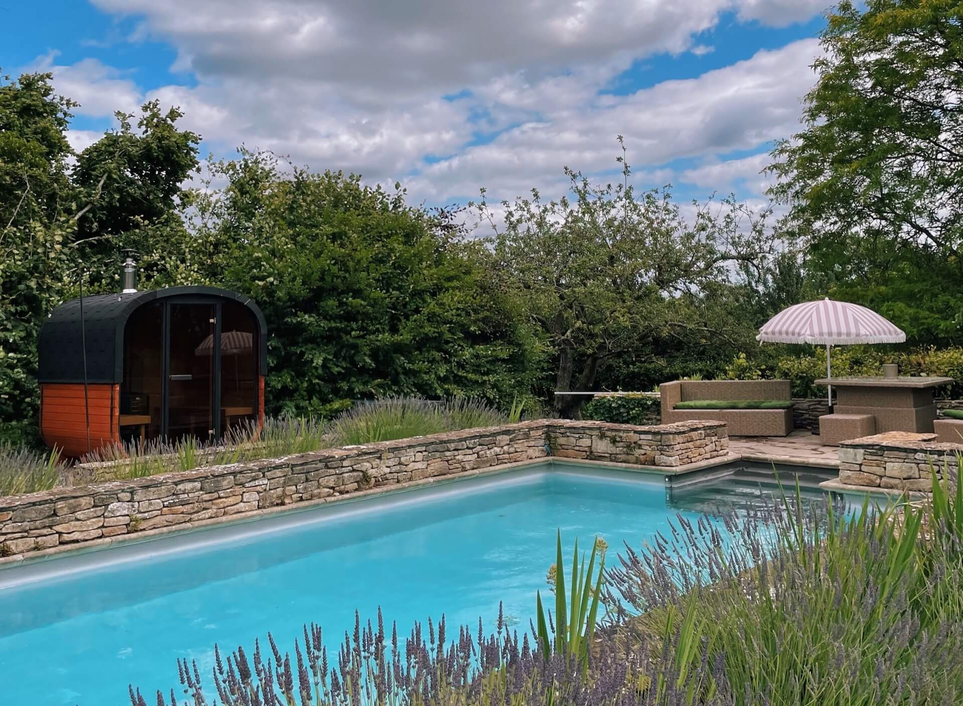 The cold water swimming pool and wood burning sauna at Church Farm Estate