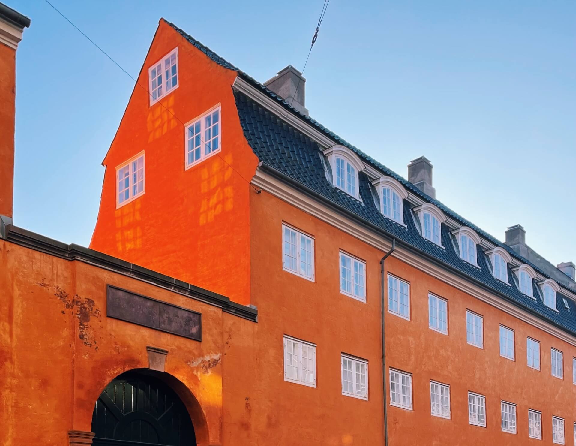 Orange Copenhagen building with blue sky