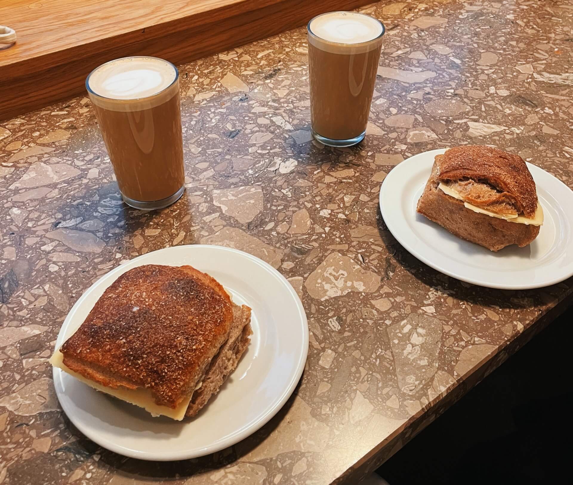 Two cheese rolls and two lattes at Coffee Collective Copenhagen