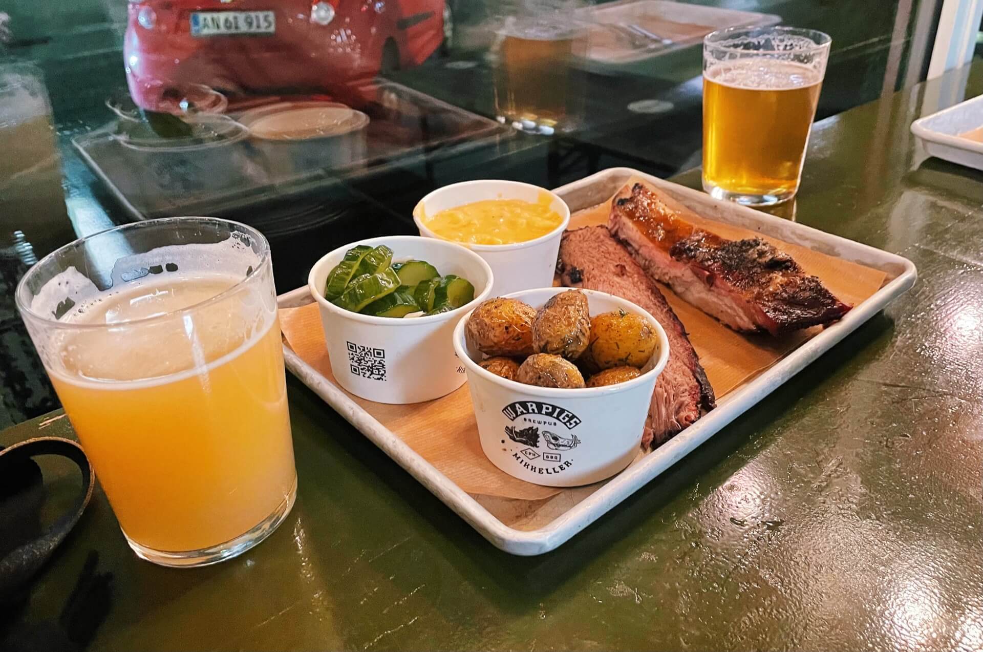 Eating authentic Texan BBQ food and craft beers at Warpigs Brewpub in the Meatpacking District of Copenhagen - a Mikkeller bar. 